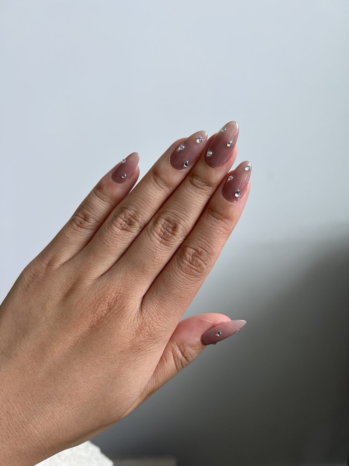 Scattered Rhinestones on a Milky Mauve Base