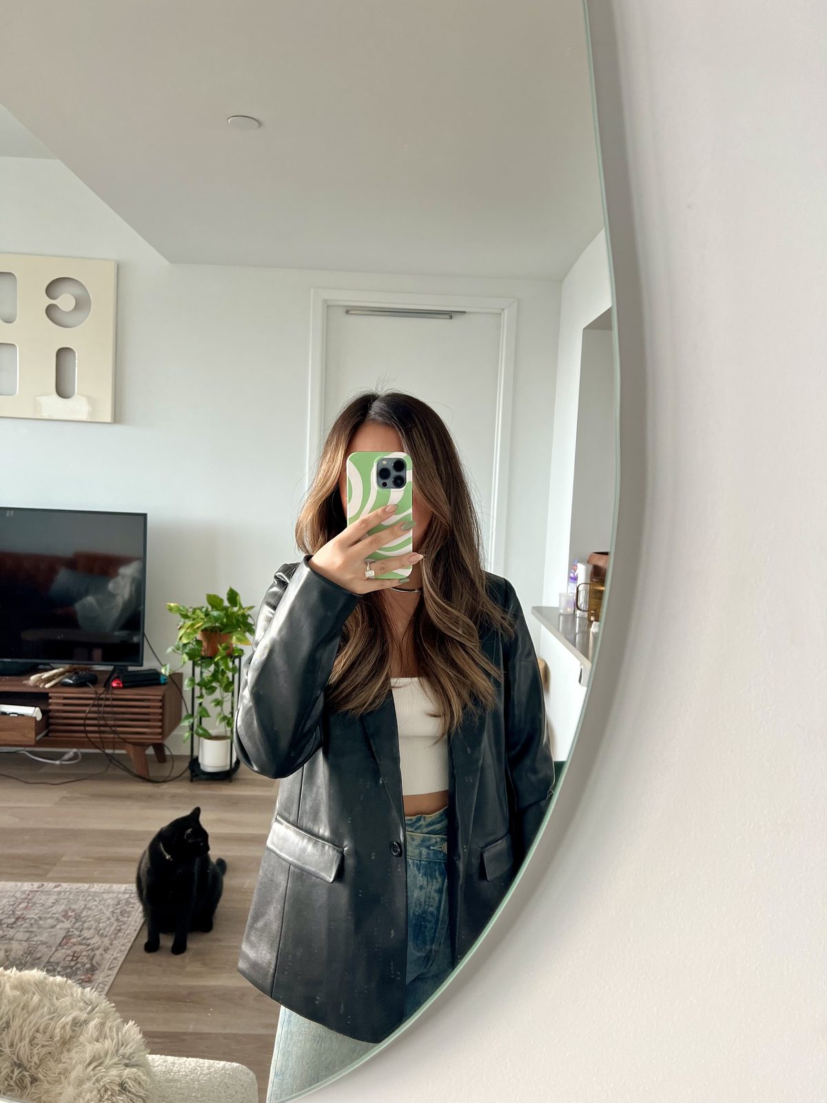 Black Faux Leather Blazer Over a White Tank + Jeans