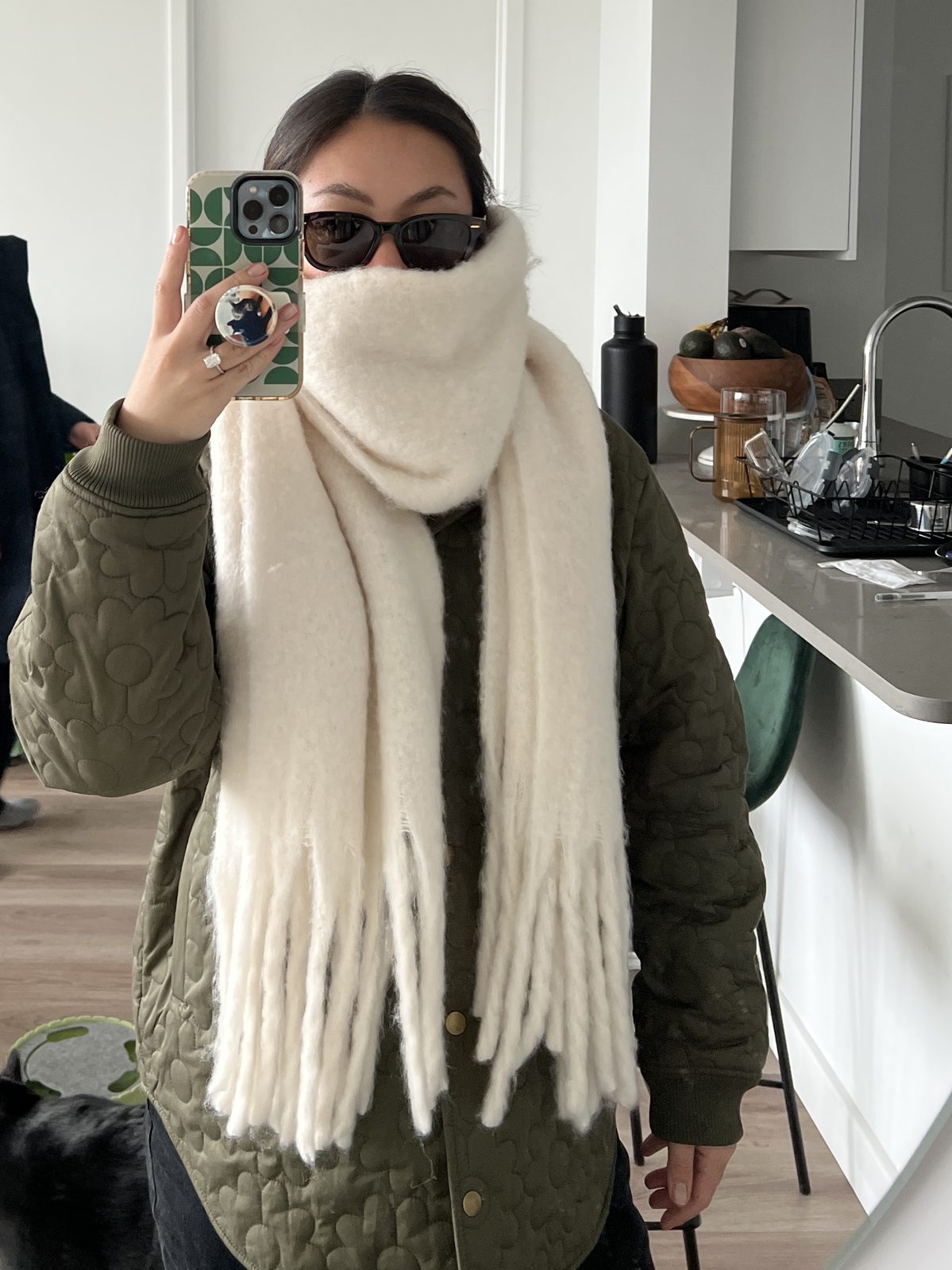 Oversized Fringe Scarf Styled Over an Olive Quilted Jacket