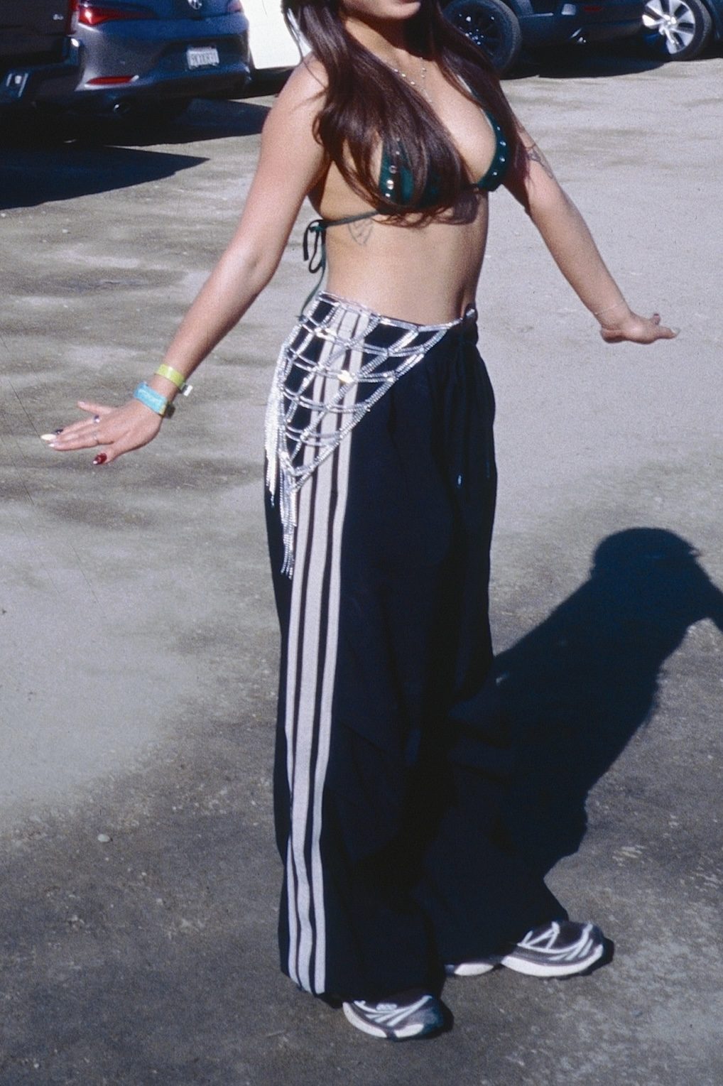 Green Bikini Top + Chain Belt Over Track Pants for Festival Season