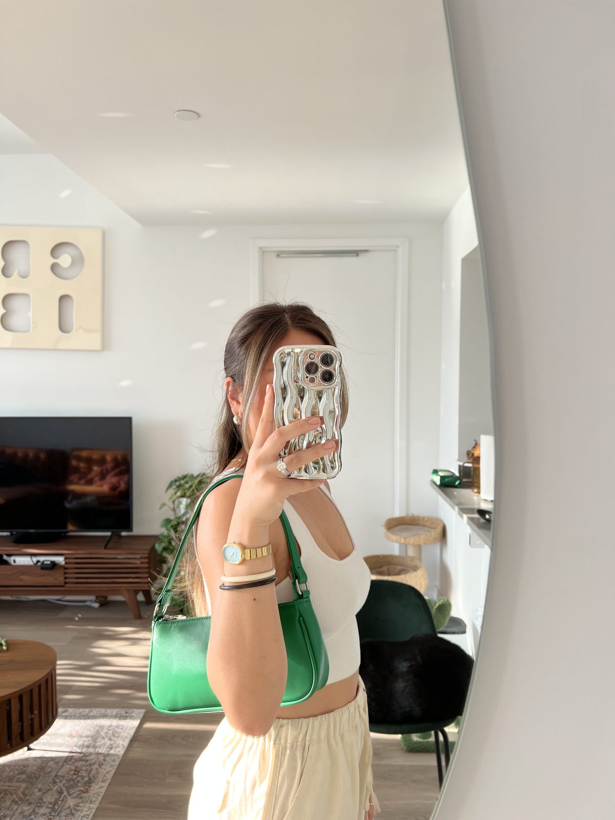 Green Shoulder Bag Styled With a Cream Tank + Pants