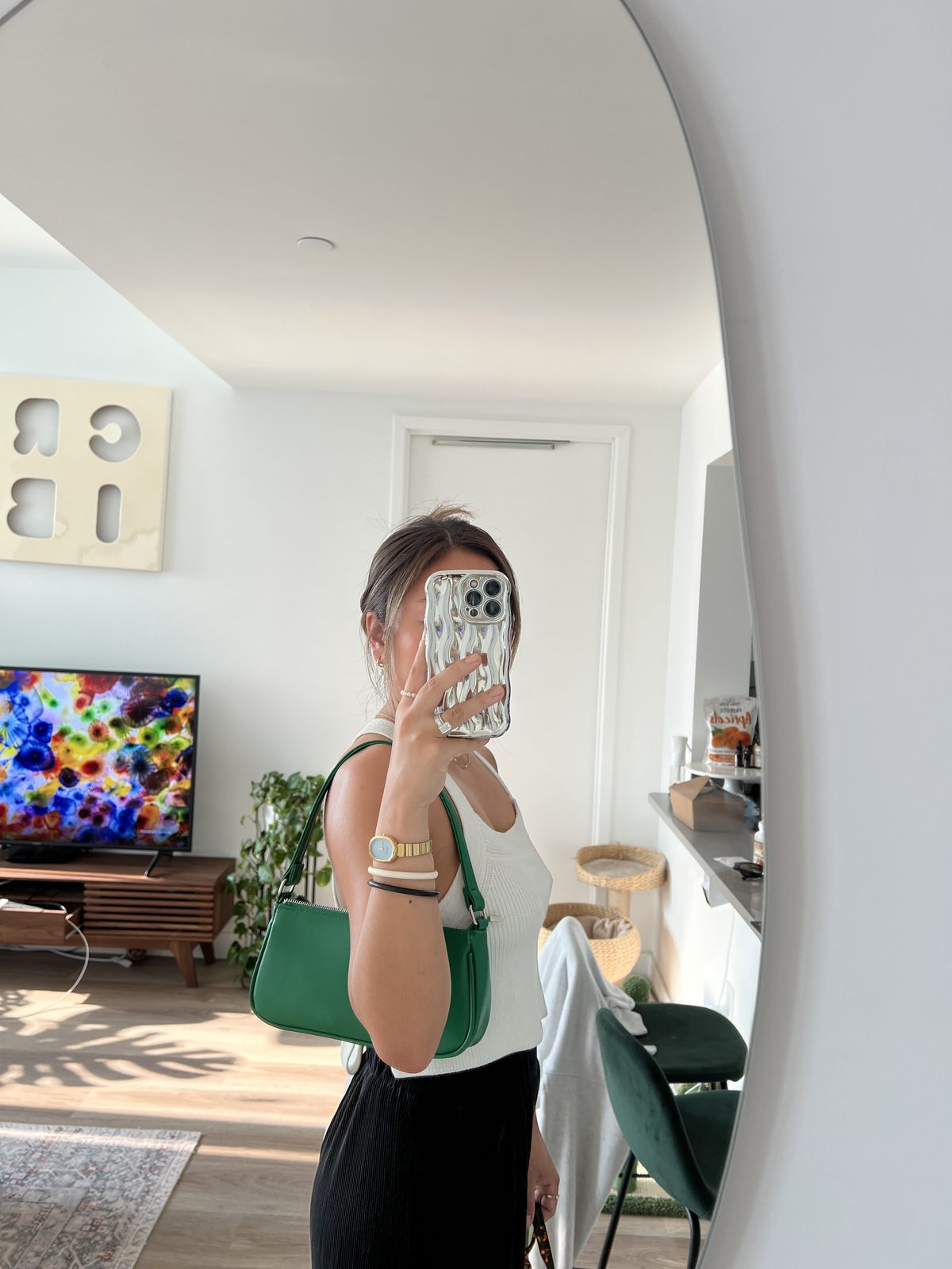 White Tank + Black Skirt with a Green Bag Accent